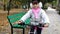 One caucasian children rides bike road in autumn park