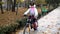 One caucasian children rides bike road in park.