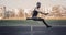 One caucasian male in a jump over a barrier. running on the stadium. Track and field runner in sport uniform in flight. energetic