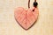 One ceramic heart of white clay with red icing. pendant with beads and waxed thread