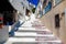 One of the charms of the Greek Cyclades islands, in the heart of the Aegean Sea, it is the white and flowery stairs