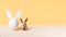 One chicken egg and quail with easter bunny ears on beige and yellow background, modern isometric easter concept