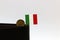 One coin of Italy Lire money and mini Italy flag stick on the black wallet with white background. REPVBBLICA ITALIANA, Lire Italia