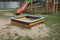 One colored square wooden sandbox