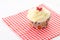 One cupcake - red patterned napkin