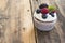 One delicious Lonely Cupcake on a Rustic Wooden Table.