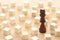 One different chess game pawn among wooden blocks. Individuality, leadership and uniqueness concept.