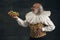 One elderly gray-haired man, medieval hystorical person, actor tasting fast food isolated on dark vintage background