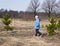 One elderly woman in the woods in spring