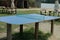 One empty sports blue tennis table