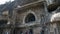 One of entrances to Aurangabad caves with tourists in front.