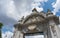 One of the entry arcs to Parque del Buen Retiro in front of blue sky, Madrid