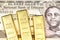 A one Ethiopian birr bank note close up with three gold bars