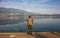 One fishermen, immersed in the quiet waters of a lake, are dedicated to sport fishing on a quiet summer afternoon.