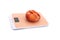 A one flat peaches on a kitchen scale on a white background. The concept of weighing