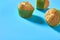 One fluffy muffin in green paper mold on blue background