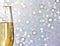 One flute of golden champagne on abstract background