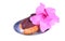 One fresh eclair on blue plate with pink sweet flower