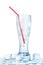 One full transparent glass of cold crystal clear water, red drinking straw, melting ice cubes, white background isolated closeup