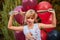 One girl aged 9 in a Halloween dress with red and black balloons in the open air in the Park, emotions, pampering, play.