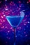 One glass blue cocktail on blue and violet tint light background