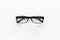 One glasses with transparent lenses on white background top view copy space closeup