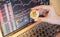 One Golden Bitcoin with Cryptocurrency on hand businesswoman  with the cryptocurrency graph for trading