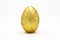 One golden egg  in crinkled metallic gold foil isolated on white background. Easter concept in minimal style