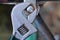 One gray adjustable wrench tightens a screw