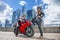 One guy and girl in a suit with a motorcycle sport bike