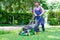 One guy portrait cutting the garden grass