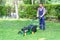 One guy portrait cutting the garden grass