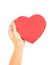 One hand holding red heart shaped box lid, love, care, healthcare, medical care, heart disease protection metaphor concept