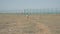 One happy running little boy refugee among desert near border in sunny day.