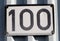 One hundred number plate