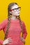 One Intelligent Clever Winsome Caucasian Blond Girl In Warm Knitted Sweater Posing With Glasses and Thoughtful Facial Expression