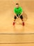 The one jumping player, caucasian fit man, playing tennis on the earthen court