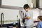 One kid preparing pancakes with a kitchen robot