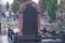 One large black brown marble gravestone