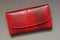 One large red closed leather wallet
