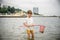 One little boy alone exploring the beach at low tide walking towards the sea coast. happy childhood concept