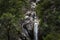 One man canyoning at the Arado Waterfall cascata do arado in the Peneda Geres National Park