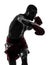 One man exercising thai boxing silhouette