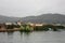 One of the man made islands of Lake Titicaca in Peru, South America with traditionally made boats in fronts of it