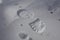 One man`s footstep on the fresh friable snow