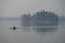 One man training rowing on the lake