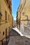 The one of many deserted narrow cozy streets in Cagliari, Sardinia, Italy