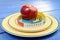 One meter ribbon around apple in the plate