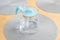 One modern light blue transparent jug full of clean fresh filtered drinking water laying on the table, object closeup, nobody