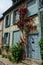 One of most beautiful french villages, Gerberoy - small historical village with half-timbered houses and colorful roses flowers,